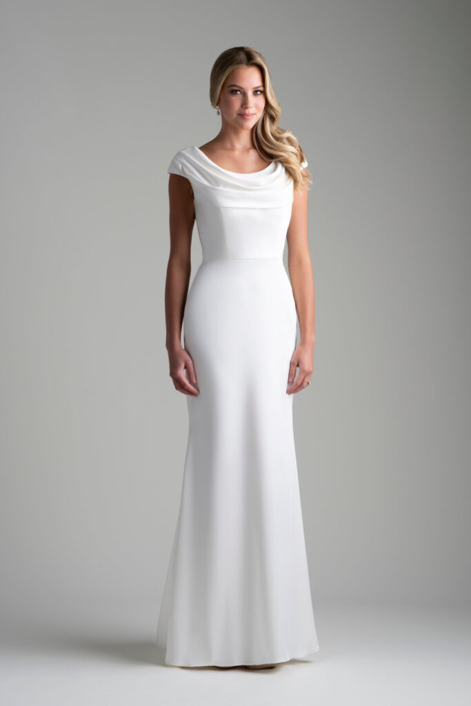 A beautifully draped cowl neck is the showpiece of this understated bridal sheath.
